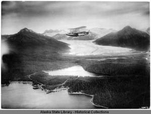 Navy_biplane_flying_over_Mendenhall_Glacier_Juneau_1926